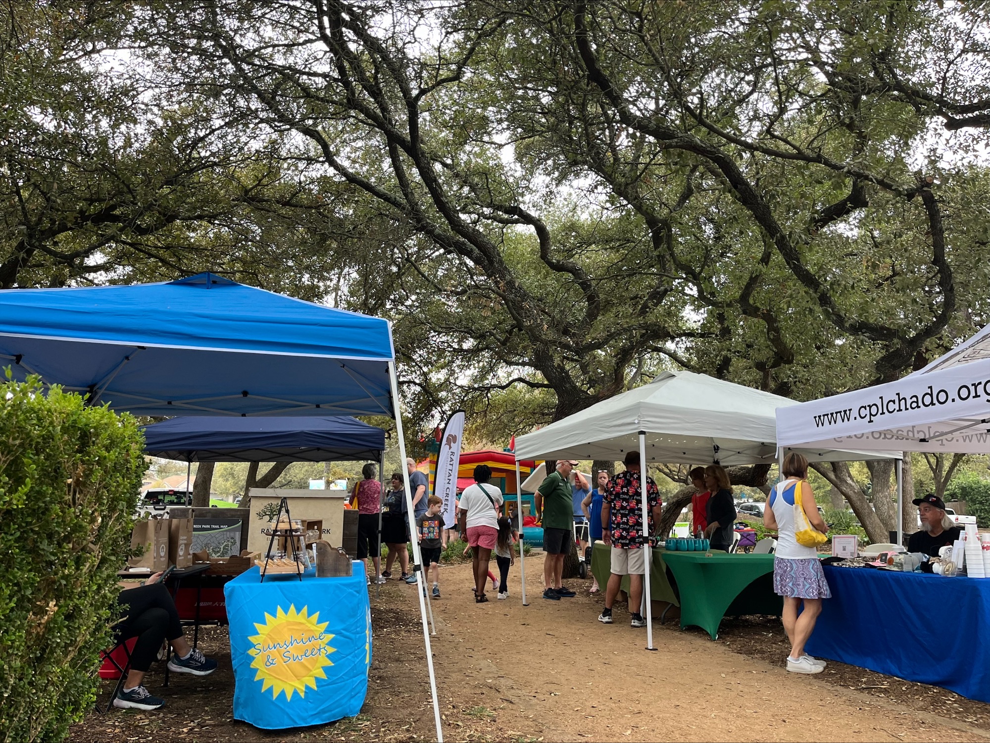 Walkway lined with vendor booths outdoors